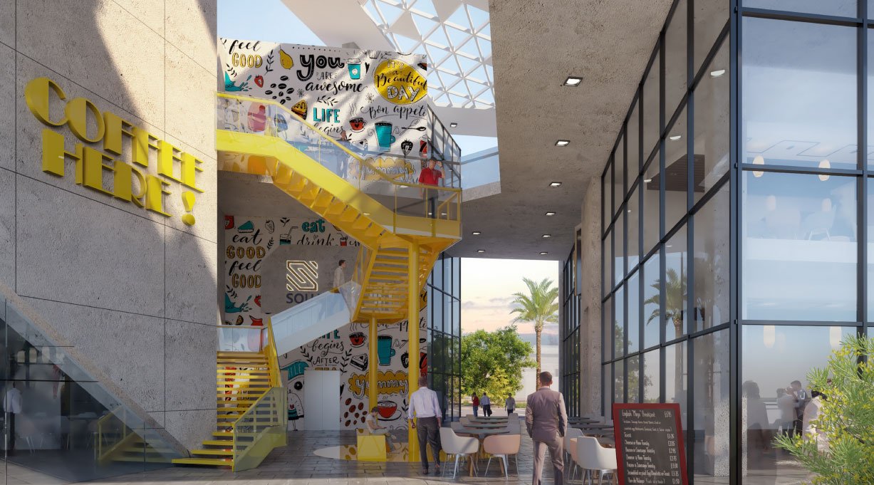 Vibrant interior space at S-Squares Uhud with decorative mural and seating options